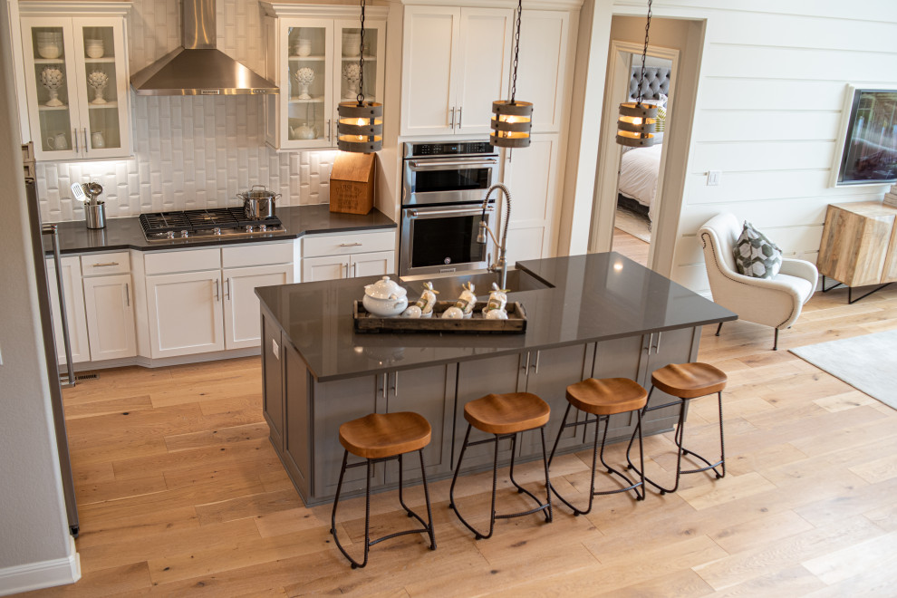 Example of a transitional kitchen design in Denver