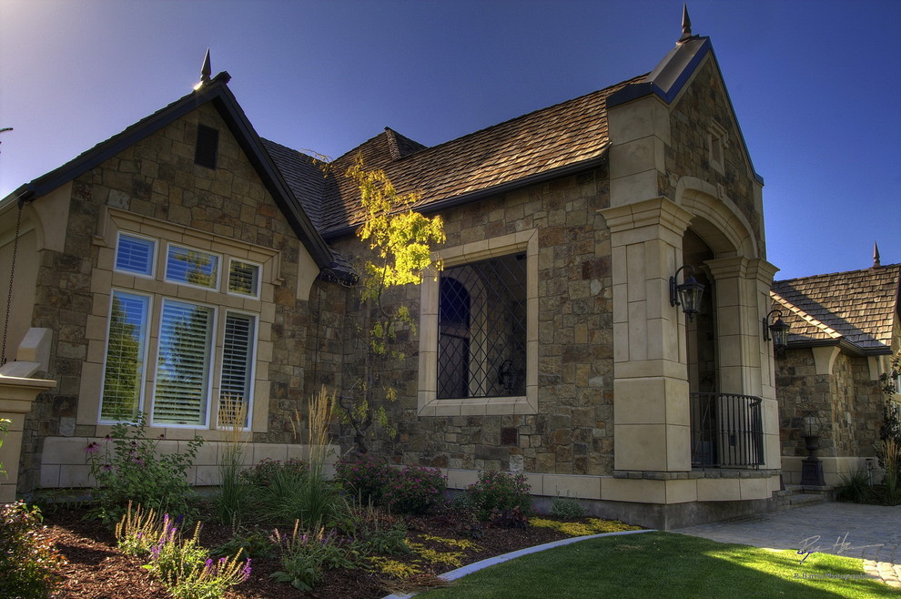 Inspiration for a traditional exterior in Other with stone veneer.