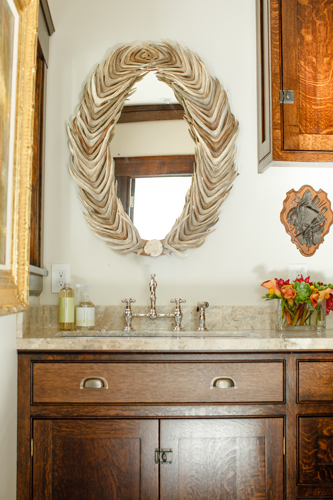 Inspiration for a traditional powder room in Portland with shaker cabinets, medium wood cabinets and an undermount sink.