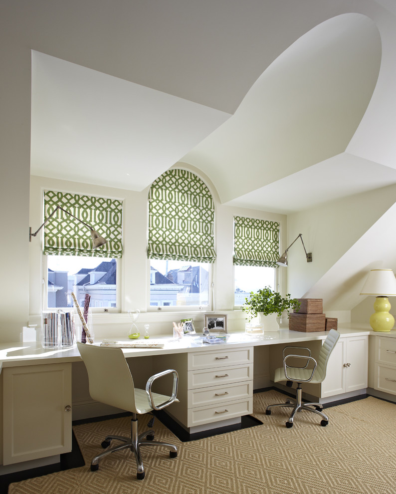 This is an example of a transitional home office in San Francisco with a built-in desk.