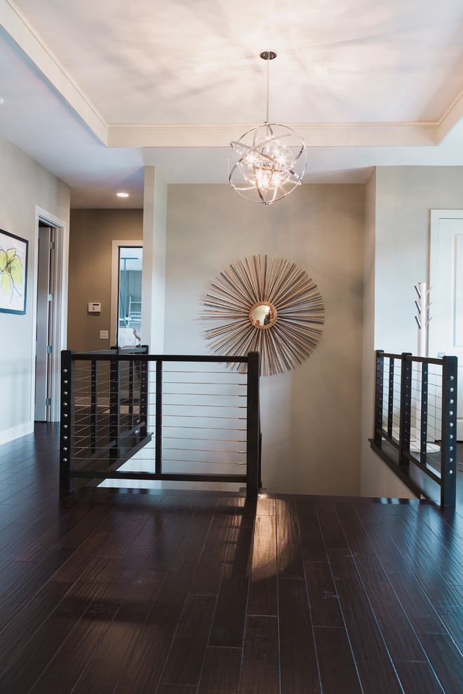 Design ideas for a mid-sized contemporary hallway in Indianapolis with grey walls and dark hardwood floors.
