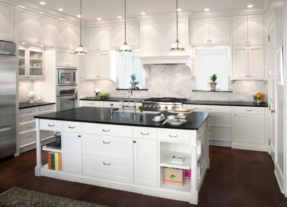Inspiration for a traditional kitchen in Chicago with stainless steel appliances and marble splashback.