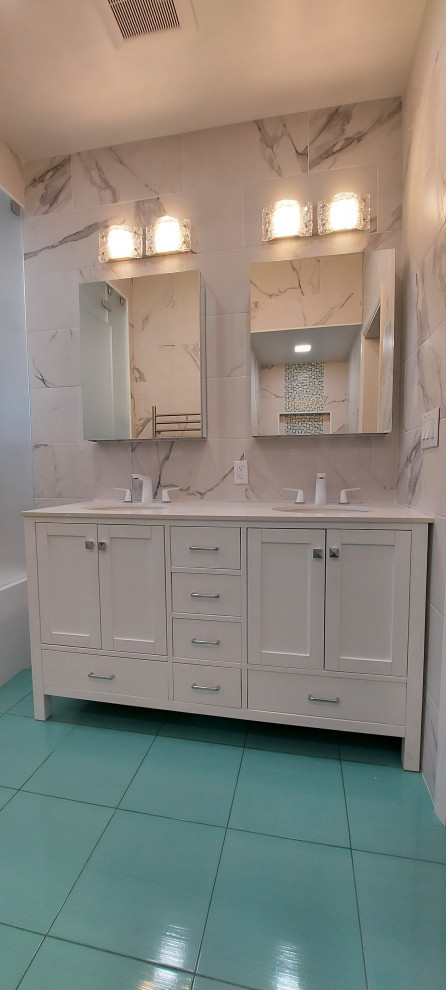 Photo of a mid-sized contemporary bathroom in New York with shaker cabinets, white cabinets, an alcove shower, a wall-mount toilet, white tile, porcelain tile, white walls, porcelain floors, with a sauna, an undermount sink, quartzite benchtops, green floor, a hinged shower door, white benchtops, a shower seat, a double vanity and a freestanding vanity.