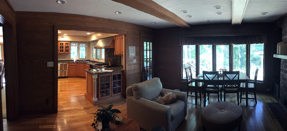 Large transitional l-shaped medium tone wood floor and brown floor eat-in kitchen photo in Indianapolis with an undermount sink, raised-panel cabinets, white cabinets, granite countertops, multicolored backsplash, porcelain backsplash, stainless steel appliances and an island