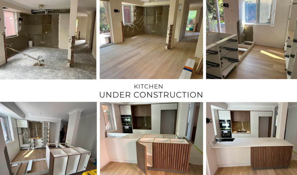 Design ideas for a mid-sized midcentury galley eat-in kitchen in Perth with a double-bowl sink, medium wood cabinets, quartz benchtops, grey splashback, mirror splashback, stainless steel appliances, with island and medium hardwood floors.