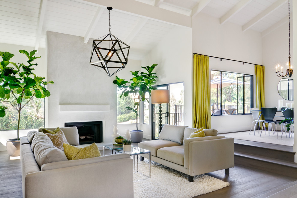 This is an example of a contemporary living room in San Diego with white walls.