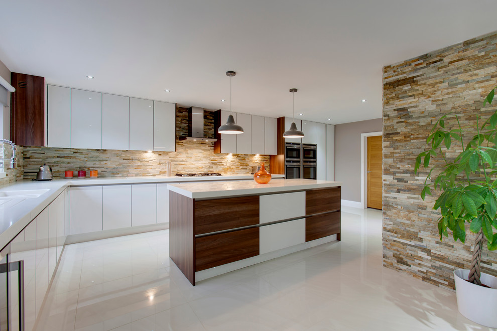 Design ideas for a large country l-shaped eat-in kitchen in Other with a drop-in sink, flat-panel cabinets, white cabinets, quartzite benchtops, stone tile splashback, stainless steel appliances, porcelain floors and with island.