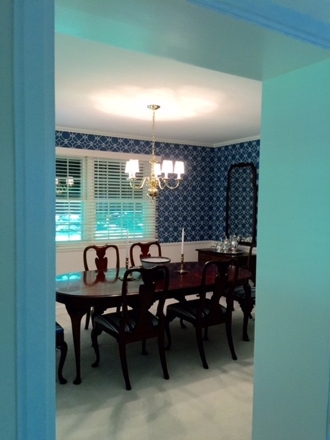 Inspiration for a mid-sized traditional kitchen/dining combo in Chicago with blue walls and carpet.