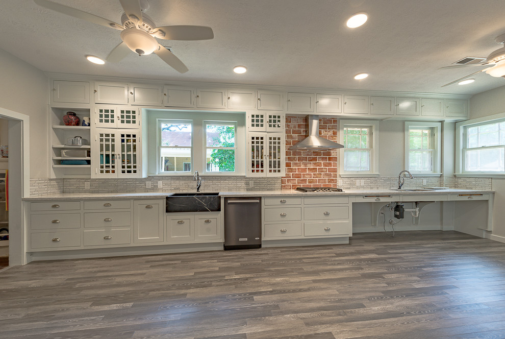 Eat-in kitchen - large rustic galley dark wood floor and multicolored floor eat-in kitchen idea in Austin with a farmhouse sink, open cabinets, white cabinets, quartzite countertops, multicolored backsplash, marble backsplash, stainless steel appliances and no island