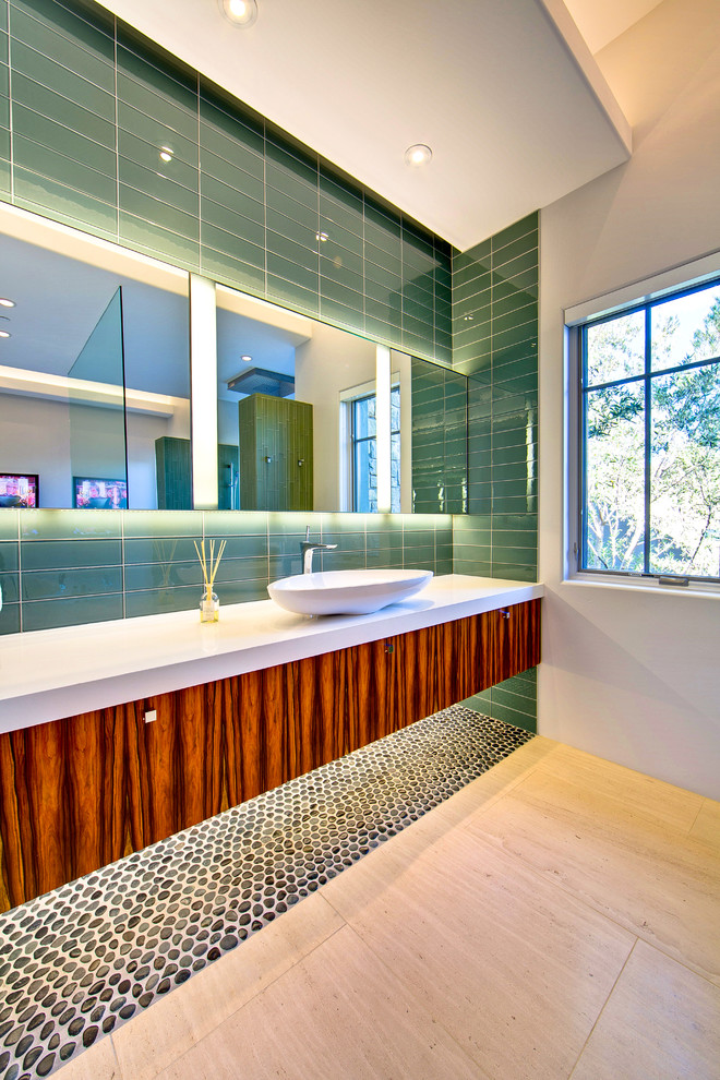 Large trendy master green tile and subway tile porcelain tile and beige floor doorless shower photo in Phoenix with a vessel sink, flat-panel cabinets, dark wood cabinets, a one-piece toilet, beige walls, quartz countertops and white countertops