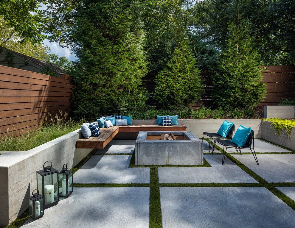 Design ideas for a large contemporary backyard patio in Atlanta with a fire feature, concrete slab and no cover.