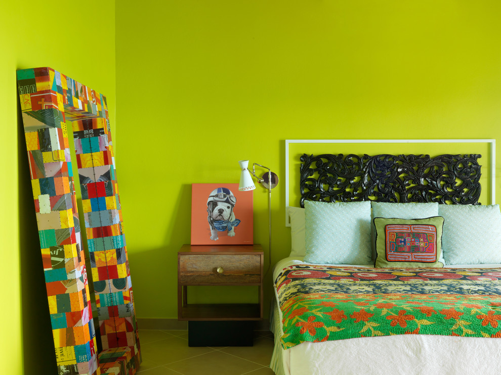 Photo of a mid-sized modern loft-style bedroom in Other with green walls and porcelain floors.
