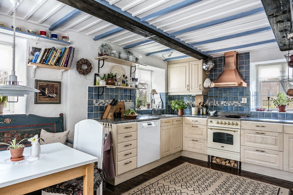 Inspiration for a small country l-shaped eat-in kitchen in Malmo with beige cabinets, granite benchtops, blue splashback, white appliances, brick floors, no island, brown floor, grey benchtop, a double-bowl sink and raised-panel cabinets.