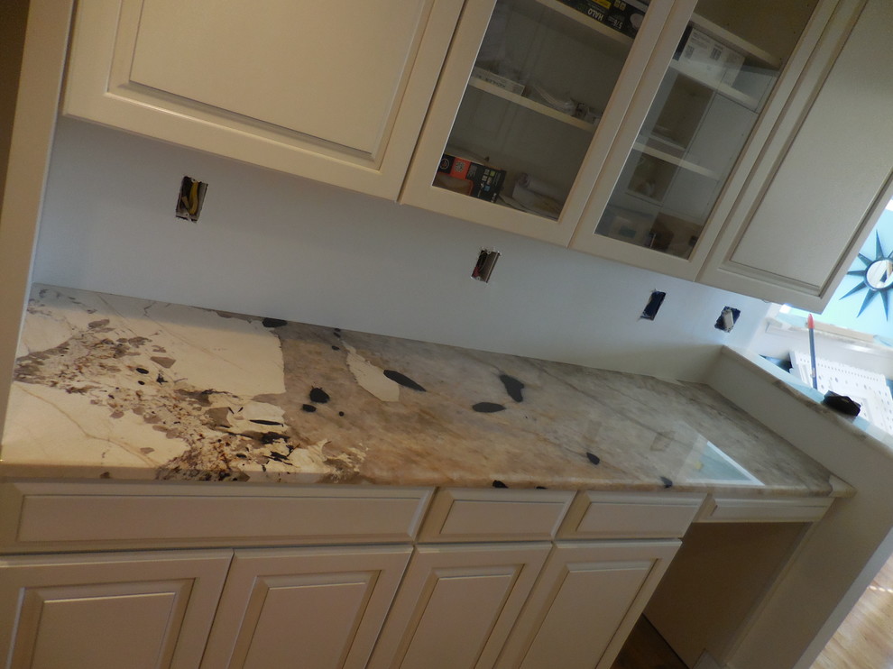 Inspiration for a mid-sized transitional kitchen remodel in Baltimore with beige cabinets and quartzite countertops
