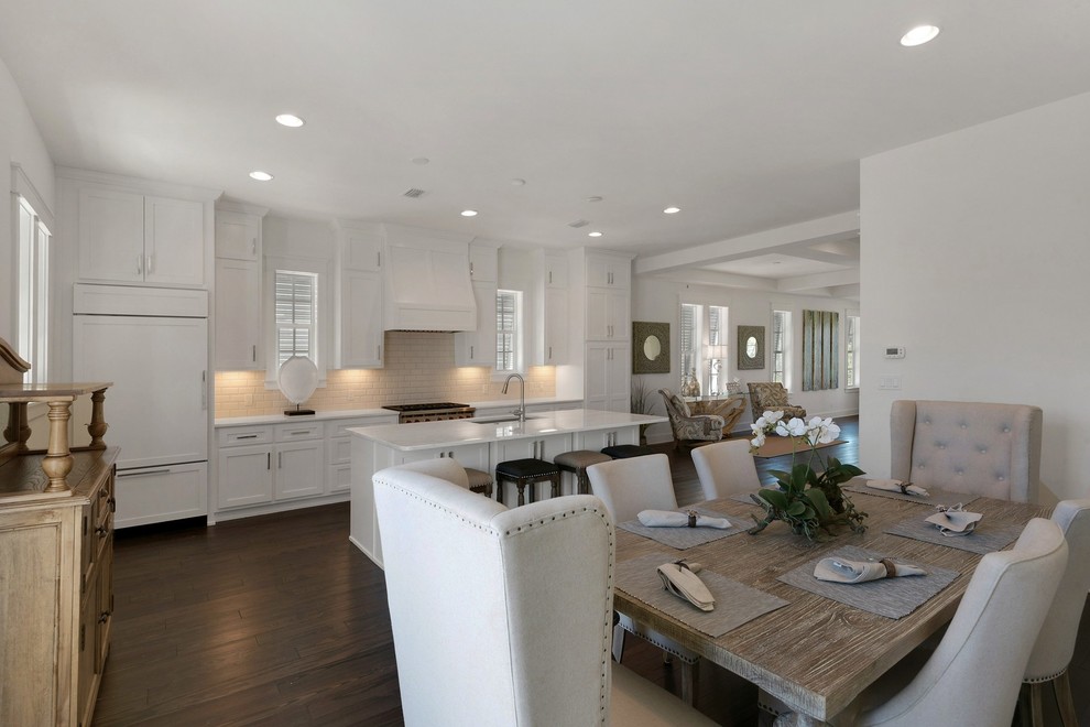 Inspiration for a mid-sized beach style kitchen/dining combo in Miami with white walls, dark hardwood floors and no fireplace.