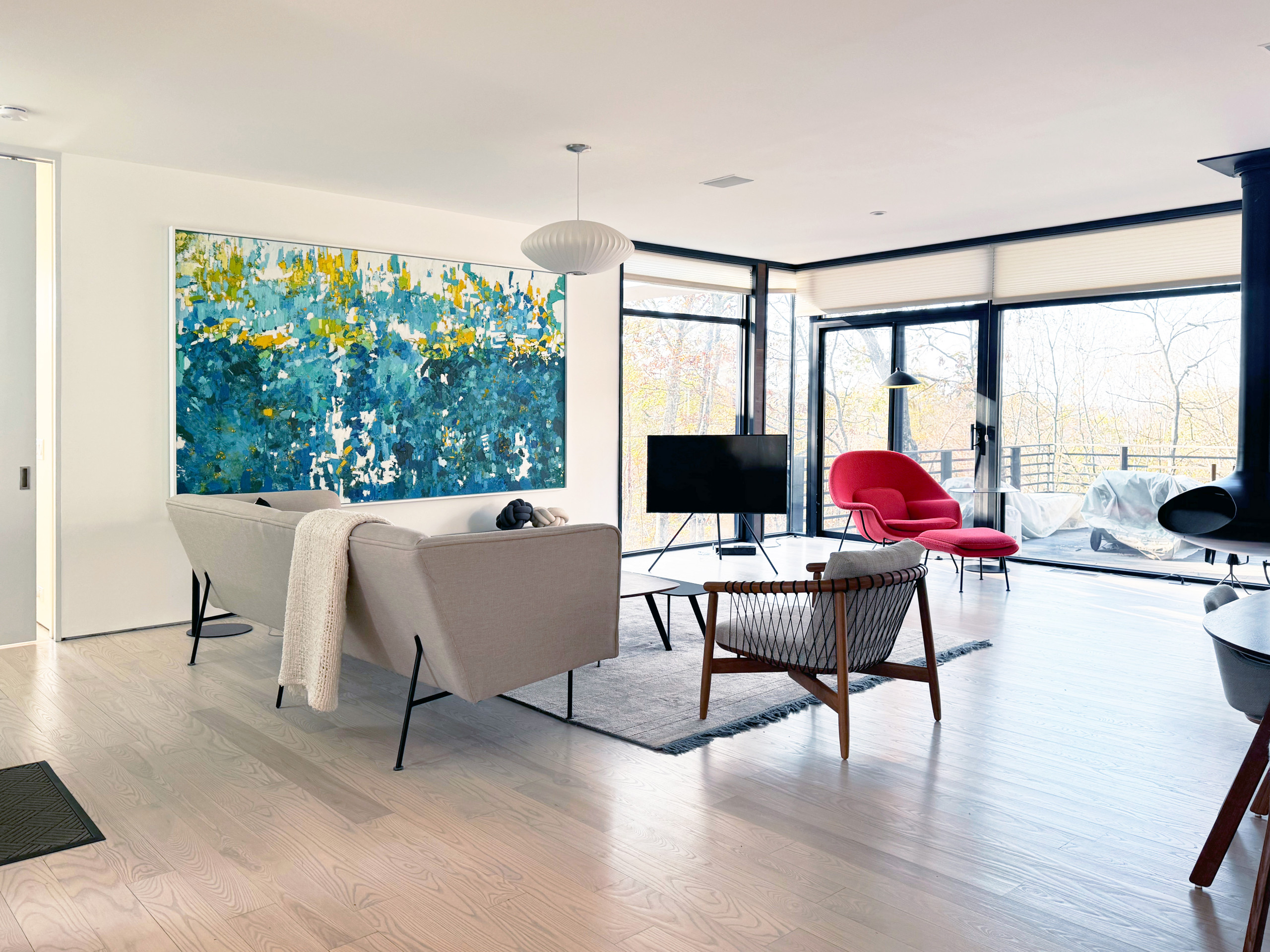 Curated furniture, a refreshed wood floor color, and thoughtful layout updates blending modern elegance with cozy charm.