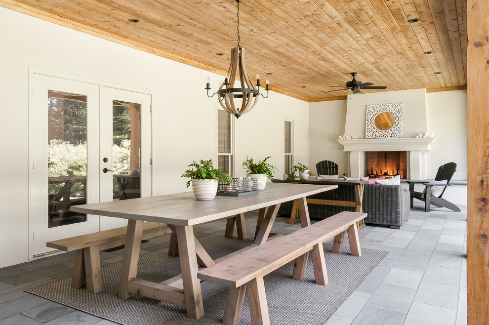 Farmhouse porch idea in Atlanta with a fire pit and a roof extension