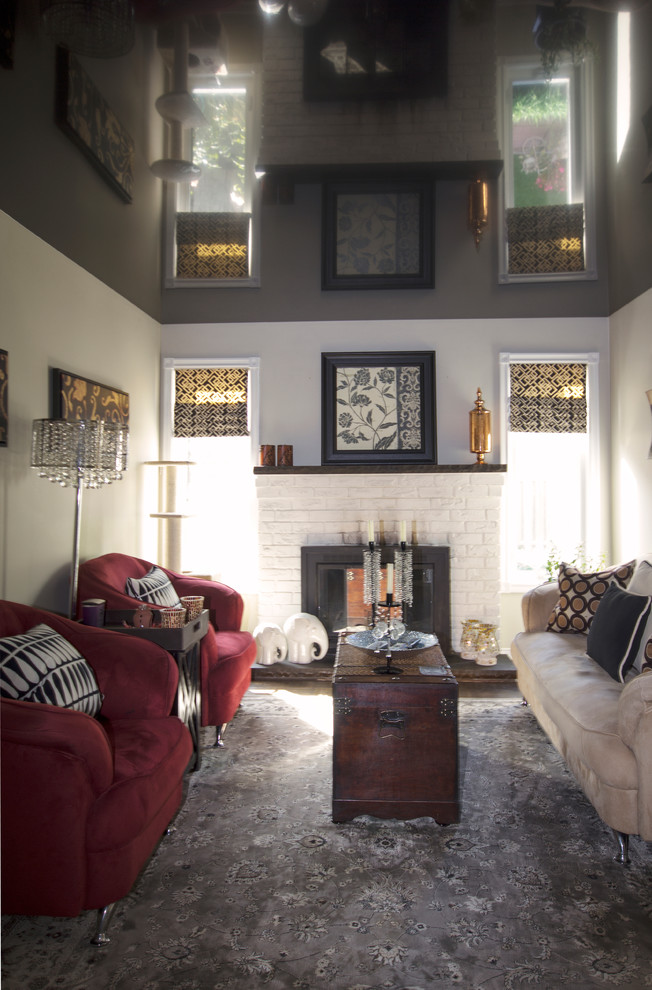 Inspiration for a small arts and crafts enclosed living room in Toronto with white walls, carpet, a standard fireplace, a brick fireplace surround and a freestanding tv.