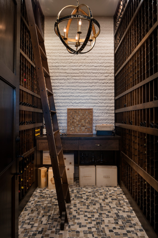 Design ideas for a transitional wine cellar in Jacksonville with storage racks and multi-coloured floor.