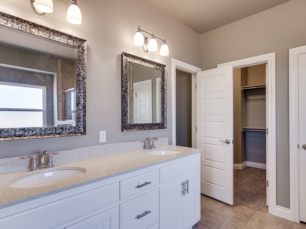 Mid-sized arts and crafts master bathroom in Oklahoma City with beaded inset cabinets, white cabinets, a corner tub, a corner shower, a two-piece toilet, beige walls, ceramic floors and an undermount sink.