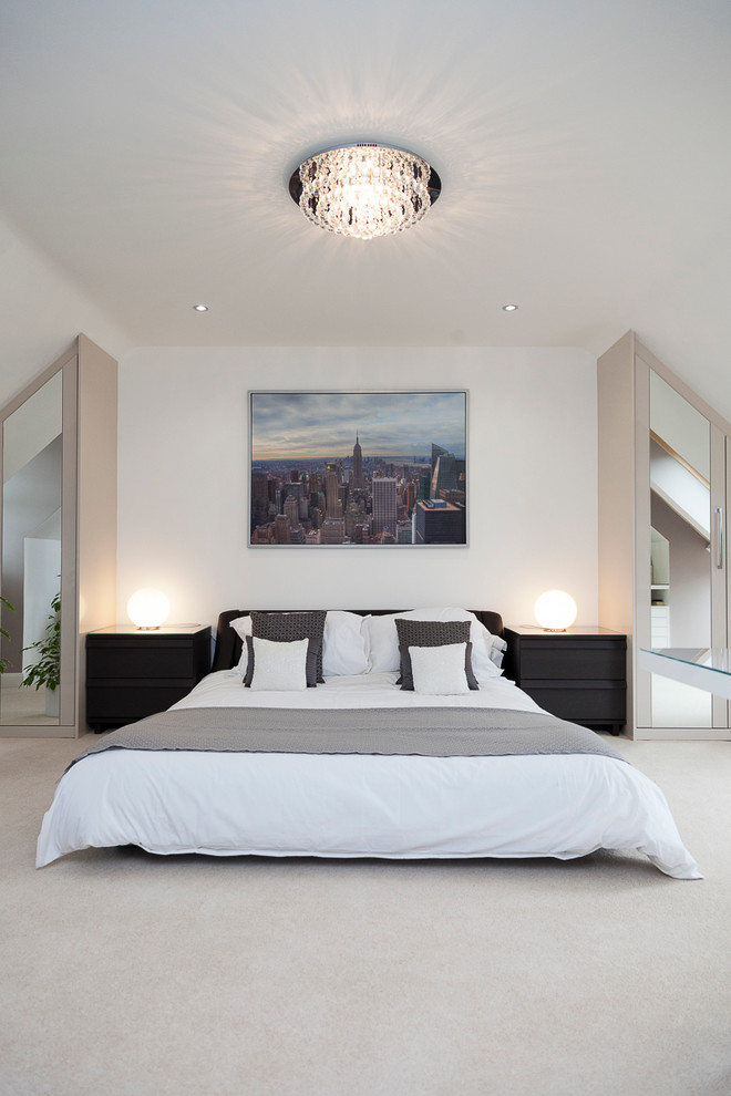Photo of a mid-sized contemporary guest bedroom in Buckinghamshire with white walls and carpet.