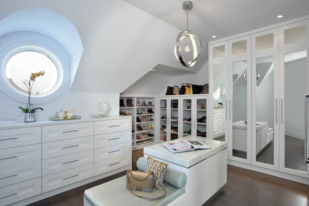 Inspiration for a transitional women's dressing room in Toronto with white cabinets, dark hardwood floors and brown floor.