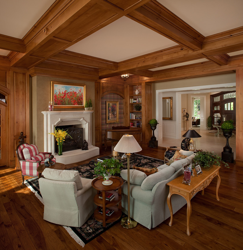 This is an example of a large traditional formal open concept living room in Grand Rapids with beige walls, carpet, a standard fireplace, no tv and a plaster fireplace surround.