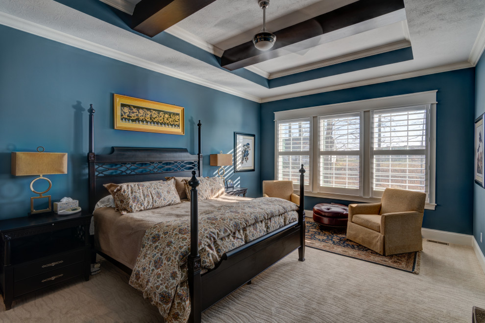 Inspiration for a mid-sized arts and crafts master bedroom in Indianapolis with blue walls, carpet and beige floor.