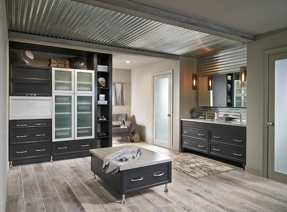 Inspiration for a large industrial master bathroom in Toronto with shaker cabinets, dark wood cabinets, an alcove shower, gray tile, metal tile, beige walls, light hardwood floors, an undermount sink, quartzite benchtops, beige floor, a hinged shower door and beige benchtops.