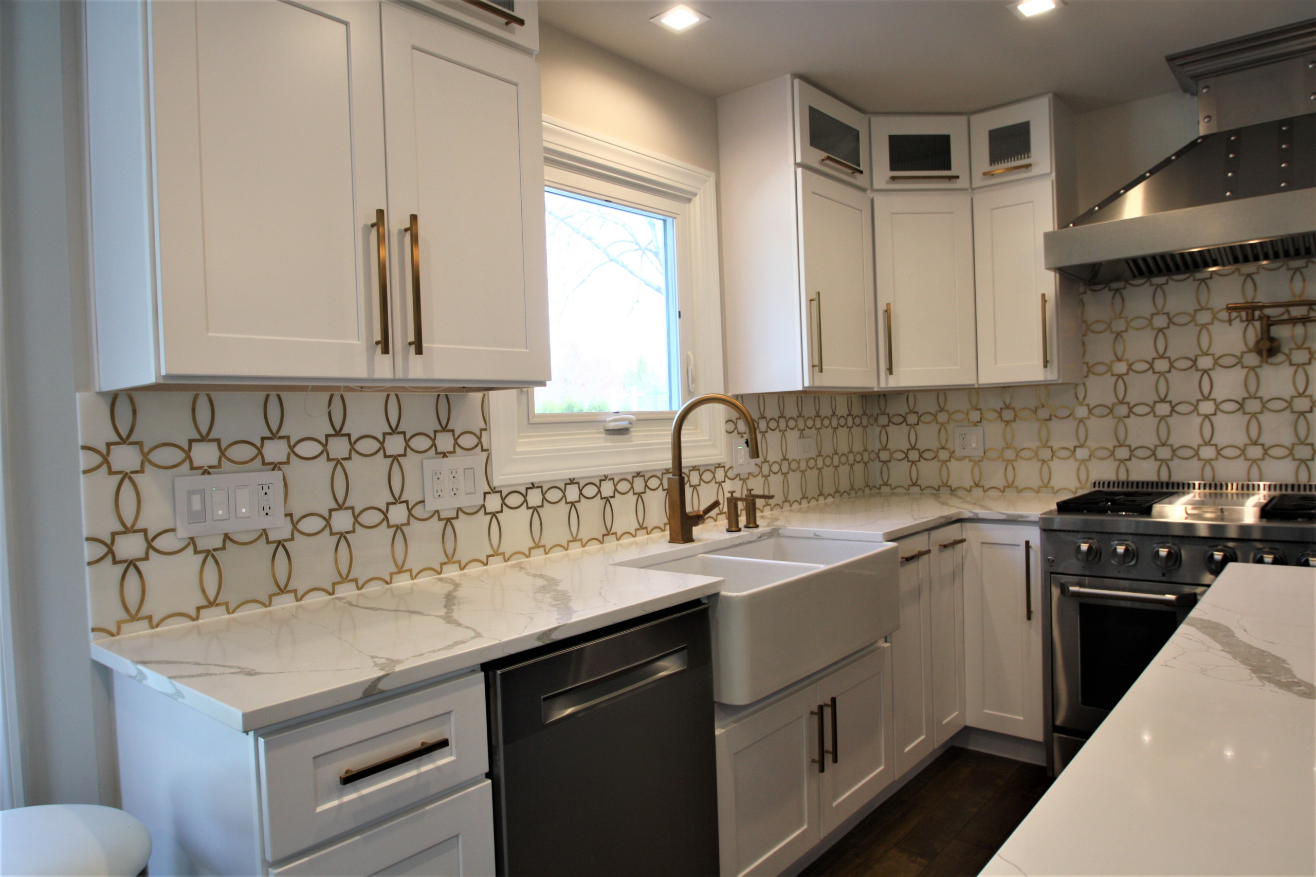 Modern kitchen design and remodel. Shaker style cabinets in white and blue.