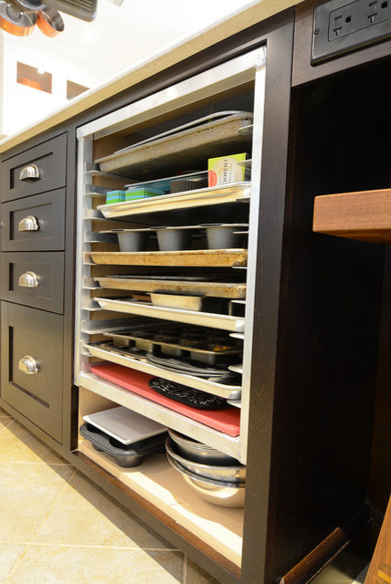Photo of a large transitional storage and wardrobe in Toronto with shaker cabinets and ceramic floors.