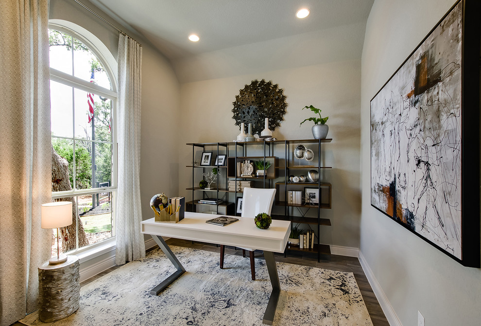 Inspiration for a transitional home office in Houston with grey walls, dark hardwood floors, no fireplace and a freestanding desk.