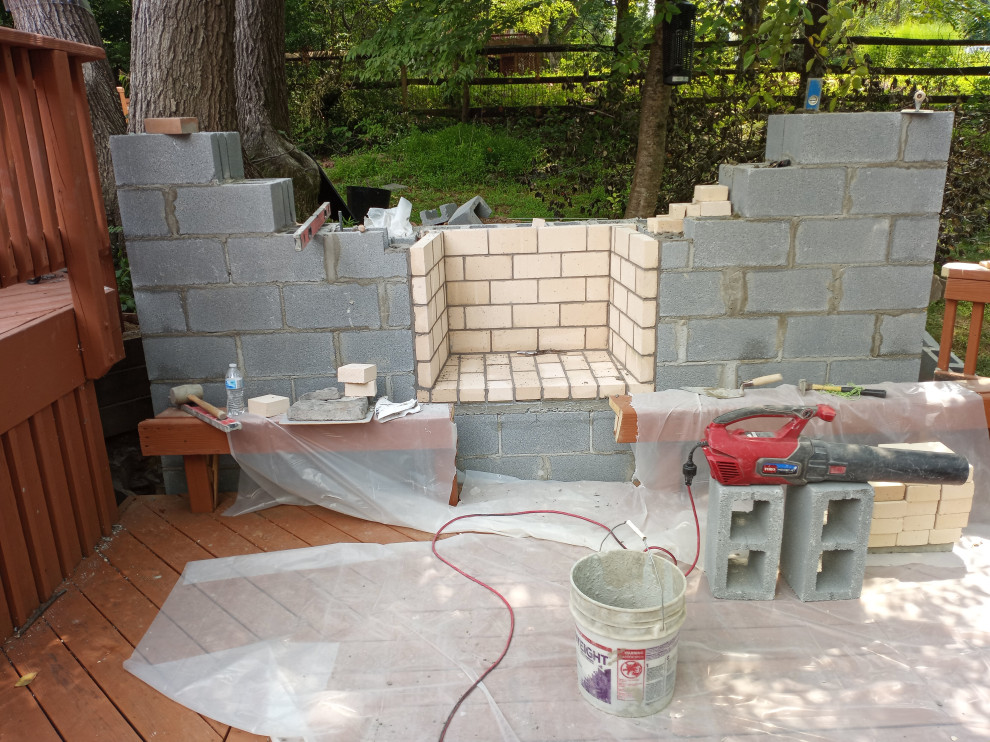 STONE FIREPLACE  , BBQ GRILL   AND STONE RETAINING WALL
