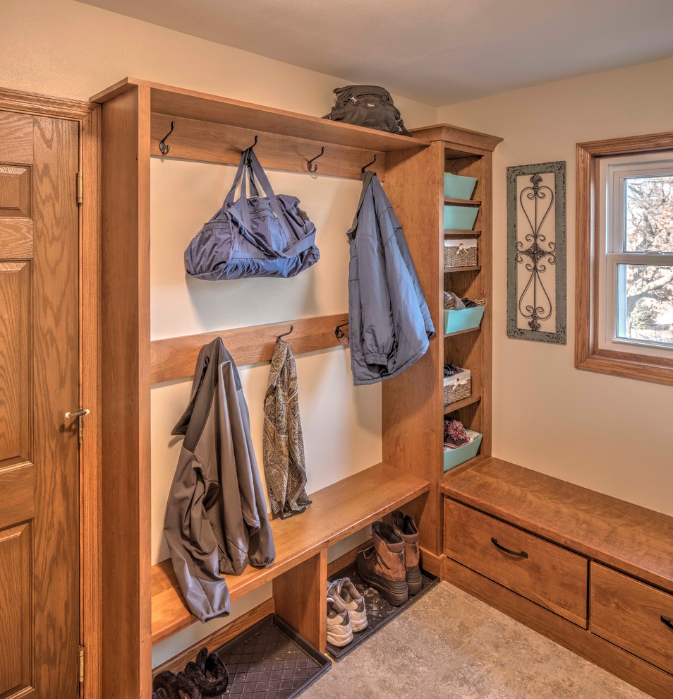 Mid-sized arts and crafts mudroom in Milwaukee with ceramic floors, beige walls, a single front door and a medium wood front door.