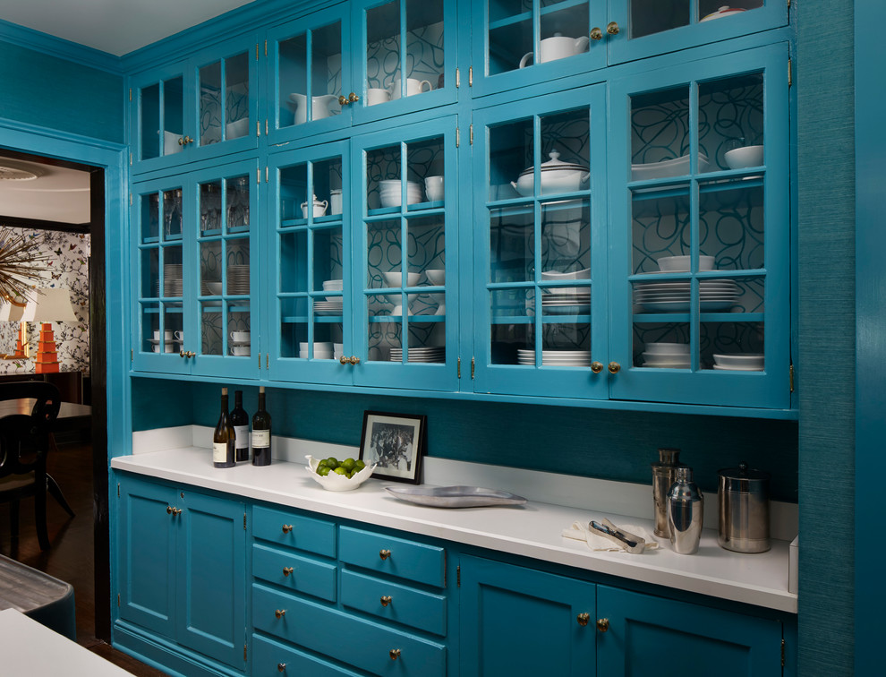 Photo of a mid-sized transitional galley kitchen pantry in Chicago with glass-front cabinets, blue cabinets, quartzite benchtops, white splashback and dark hardwood floors.