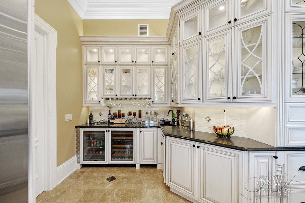Expansive traditional kitchen pantry in Tampa with an undermount sink, open cabinets, white cabinets, quartz benchtops, black splashback, glass sheet splashback, stainless steel appliances, marble floors and with island.