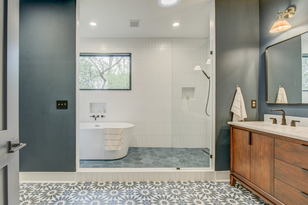 Mid-sized modern master bathroom in Atlanta with flat-panel cabinets, brown cabinets, a freestanding tub, an open shower, white tile, ceramic tile, grey walls, ceramic floors, a drop-in sink, engineered quartz benchtops, grey floor, a hinged shower door, beige benchtops, a double vanity, a freestanding vanity and coffered.
