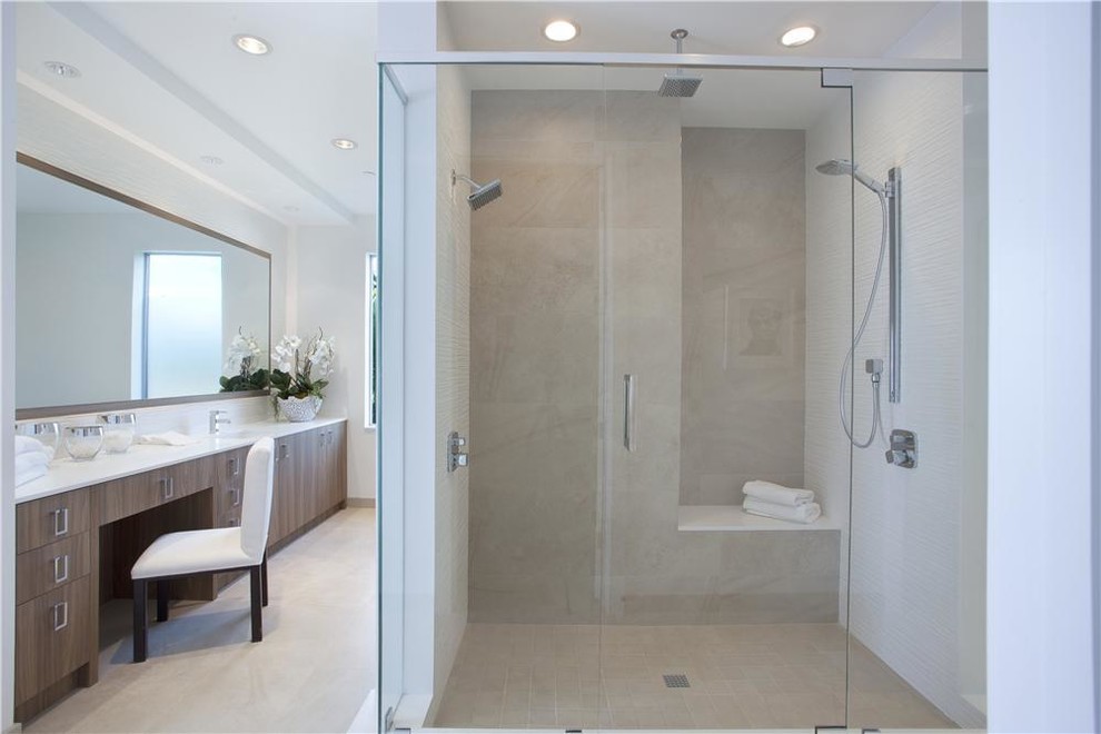 Mid-sized contemporary master bathroom in New York with flat-panel cabinets, light wood cabinets, a japanese tub, an alcove shower, white walls, travertine floors, beige floor and a hinged shower door.