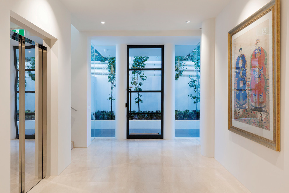 Design ideas for a mid-sized contemporary foyer in Melbourne with white walls, marble floors, a single front door, a black front door and beige floor.