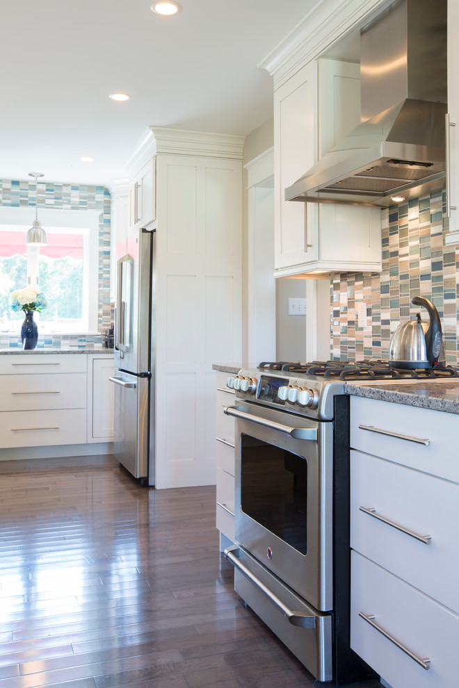 Inspiration for a large contemporary u-shaped dark wood floor and brown floor eat-in kitchen remodel with an undermount sink, recessed-panel cabinets, dark wood cabinets, quartz countertops, multicolored backsplash, matchstick tile backsplash, stainless steel appliances, two islands and white countertops