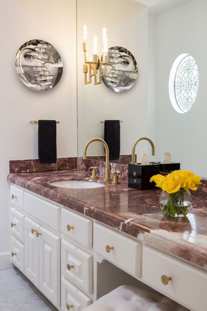 Photo of a mid-sized country powder room in San Francisco with recessed-panel cabinets, white cabinets, white tile, marble, white walls, marble floors, an undermount sink, marble benchtops, white floor, red benchtops and a built-in vanity.