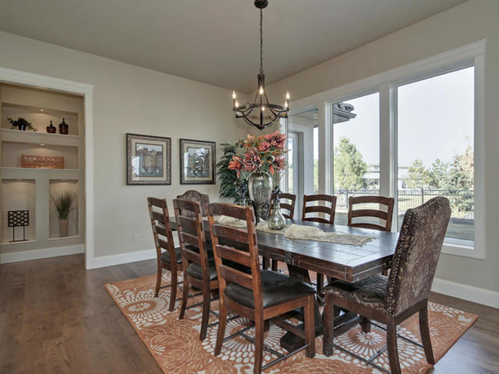 This is an example of a mid-sized arts and crafts open plan dining in Boise with grey walls, medium hardwood floors, no fireplace and brown floor.