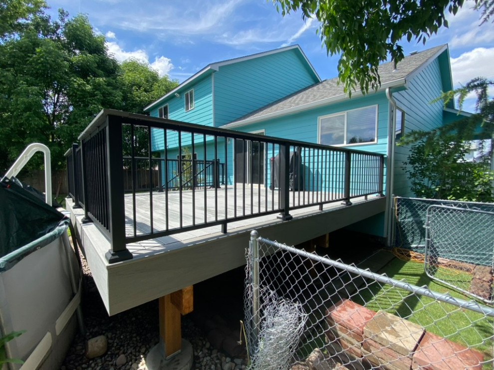 Inspiration for a large backyard metal railing deck remodel in Seattle