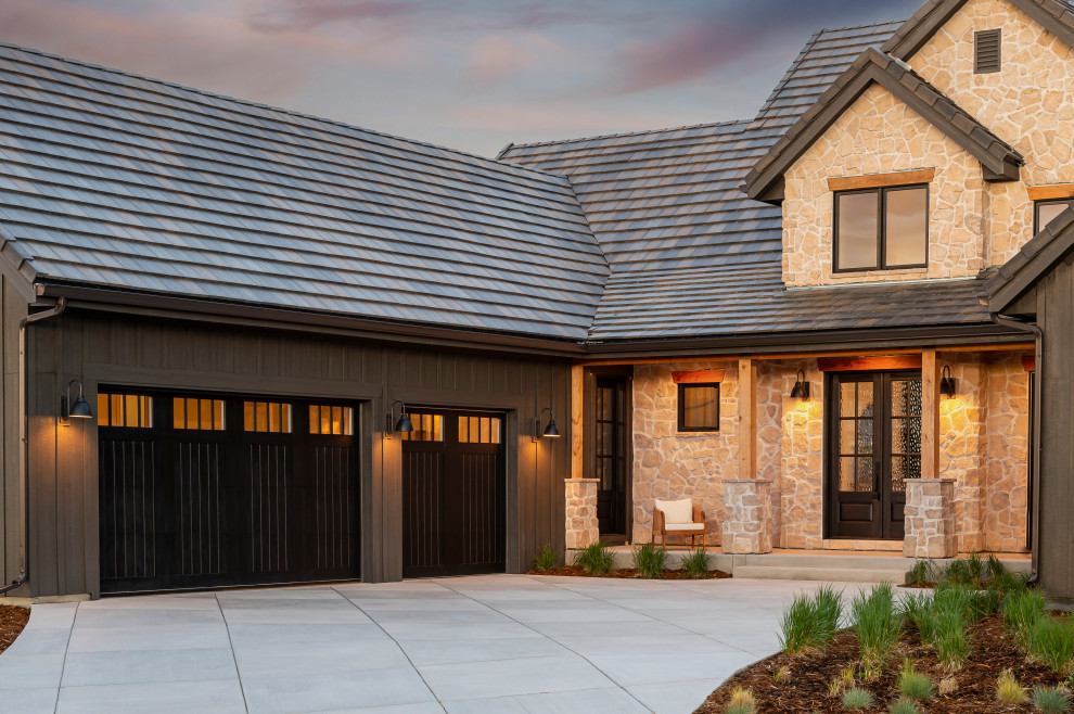 Inspiration for a large rustic attached three-car garage remodel in Denver