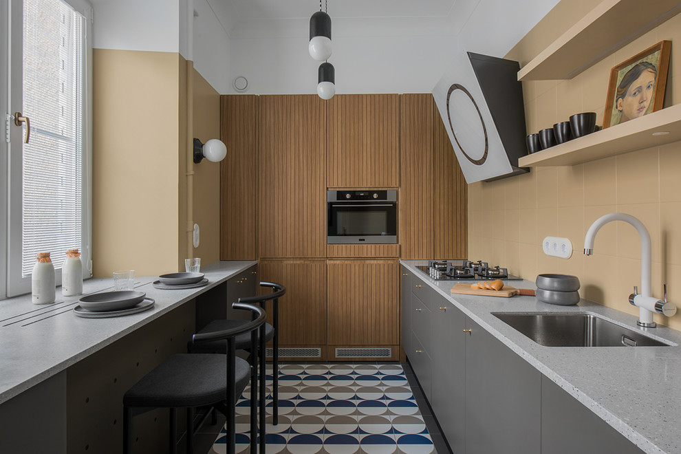 Inspiration for a small modern l-shaped separate kitchen in Moscow with an undermount sink, flat-panel cabinets, grey cabinets, beige splashback, stainless steel appliances, no island, multi-coloured floor, grey benchtop and terrazzo benchtops.