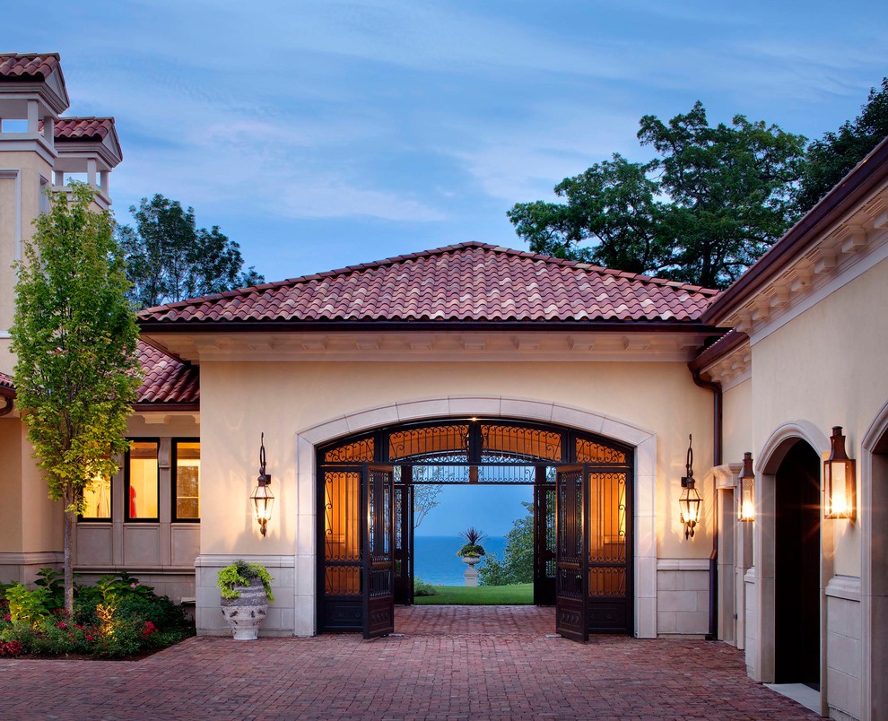 This is an example of a mediterranean attached porte cochere in Chicago.