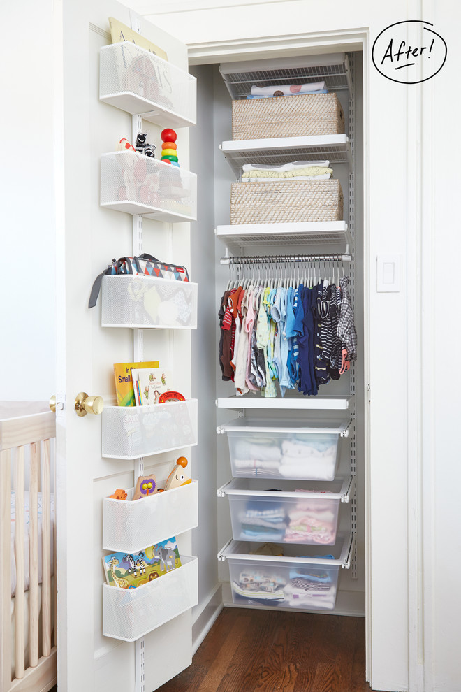 Example of a transitional gender-neutral medium tone wood floor nursery design with white walls