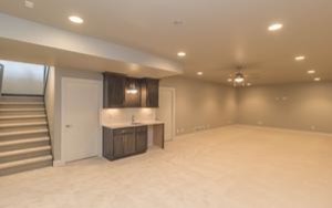 Basement - mid-sized transitional underground carpeted basement idea with gray walls and no fireplace
