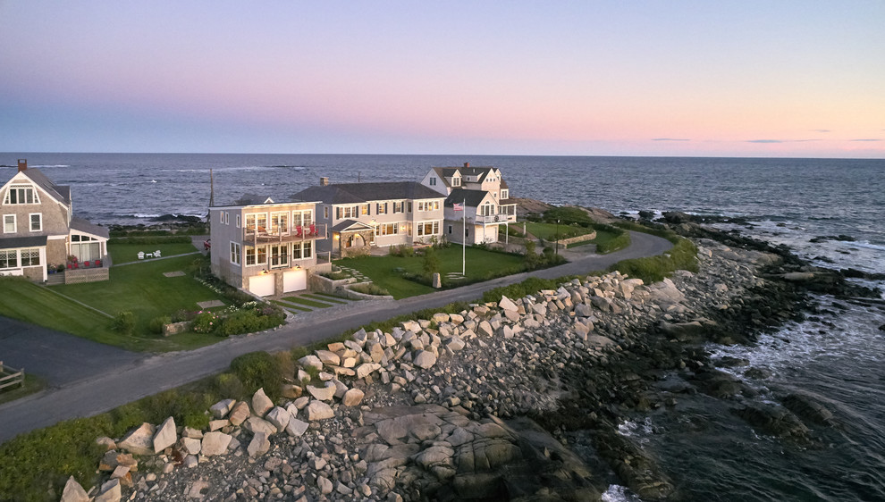 Photo of a beach style home design in Portland Maine.