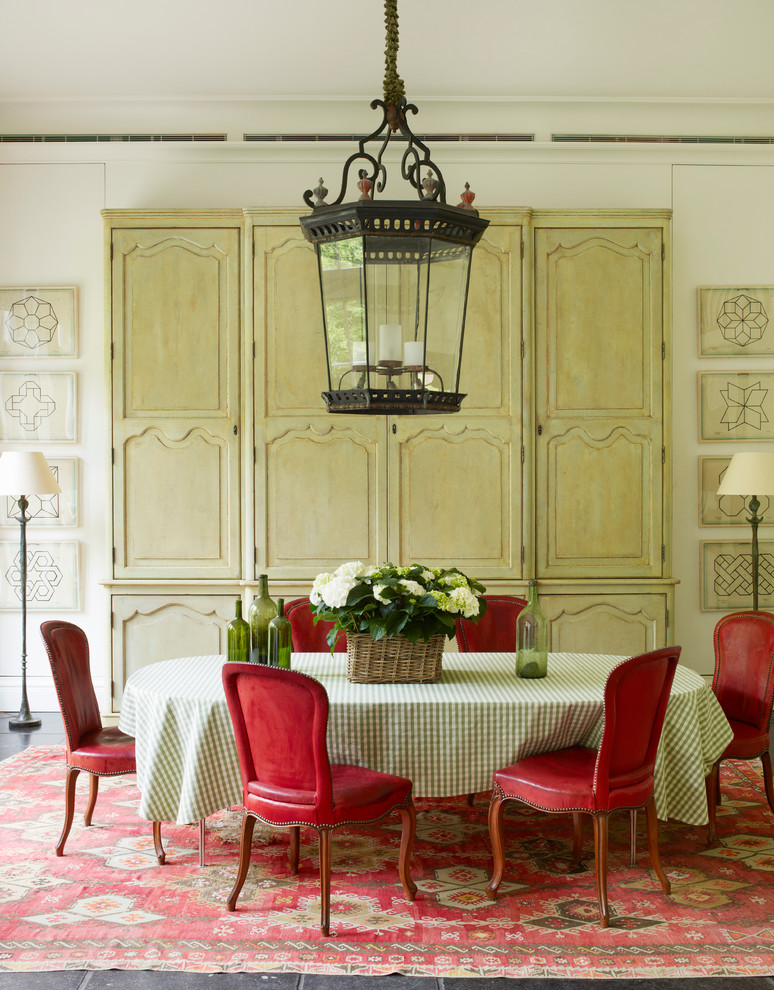 Photo of a traditional dining room in London with white walls.